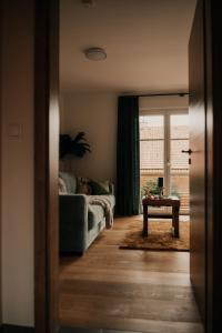 a living room with a couch and a table at Wohnung Finstermünz in Lenggries