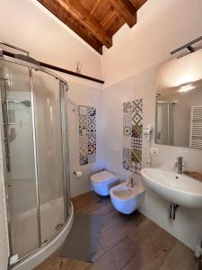 a bathroom with a shower and a sink and a toilet at B&B Convivium in Stazzema +40 photos