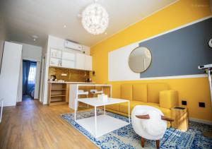 a living room with a couch and a table at Discovery Saipan Hotel in Garapan