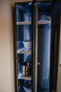 a cupboard filled with lots of pots and pans at Wohnung Finstermünz in Lenggries