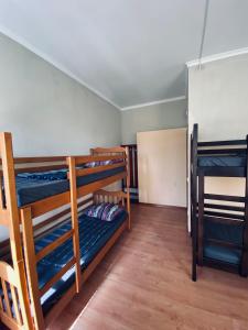 a room with three bunk beds in a room at Hostel Serge in Lviv +39 photos