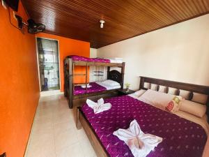 Postel nebo postele na pokoji v ubytování Hotel Caribe La Vega