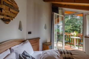 Posteľ alebo postele v izbe v ubytovaní Hotel Bella di Bosco