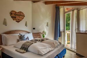Posteľ alebo postele v izbe v ubytovaní Hotel Bella di Bosco