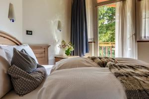 Posteľ alebo postele v izbe v ubytovaní Hotel Bella di Bosco