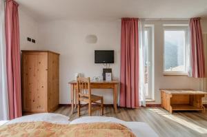 Posteľ alebo postele v izbe v ubytovaní Hotel Bella di Bosco