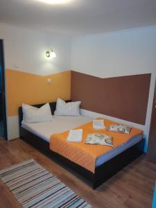 Giường trong phòng chung tại Apartamente Ambrus E Studio 21 Praid