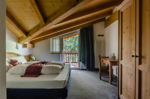 Posteľ alebo postele v izbe v ubytovaní Hotel Bella di Bosco
