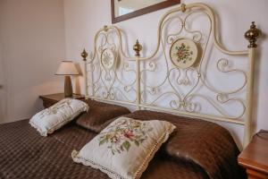 a bedroom with two beds with pillows on them at La Casa di Alice in Villa San Secondo