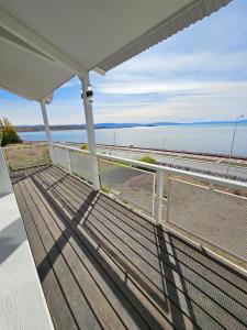 a view of the beach from the balcony of a house at Bahia Rooms in El Calafate