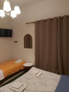Postel nebo postele na pokoji v ubytování Ermis Hotel
