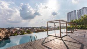 a view from the roof of a building with a pool at APARTMENT GRAND KAMALA LAGOON MY KIDS in Pulosirih