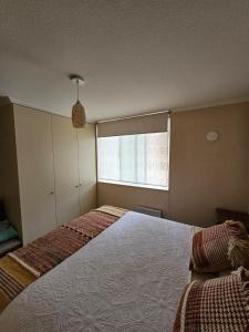 Кровать или кровати в номере Apartamento full equipado
