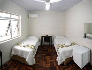 Postel nebo postele na pokoji v ubytování Hotel Pax
