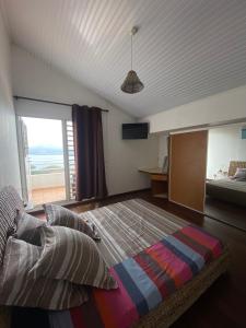 Postel nebo postele na pokoji v ubytování Ti Panoramik