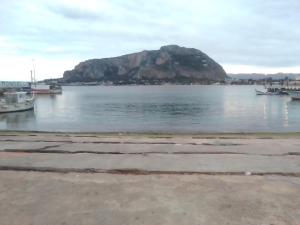 a small island in the water with boats in it at Na' zà Ciccina in Palermo +10 photos