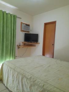 TV a/nebo společenská místnost v ubytování Residencial Thermas do Bandeirante + 26 fotografií