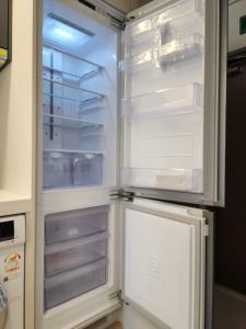 an empty refrigerator with its door open in a kitchen at World-cup stadium, New house, full optioned in Goyang