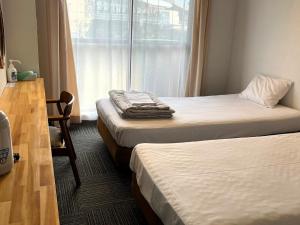 Cama o camas de una habitación en CHENDA INTERNATIONAL HOTEL - Vacation STAY 82740v