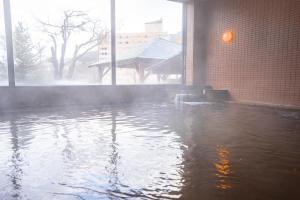 a pool of water in front of a building at CHENDA INTERNATIONAL HOTEL - Vacation STAY 99536v in Seki