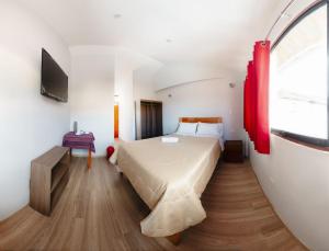Voodi või voodid majutusasutuse Cochito Cusco toas