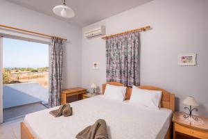 Postel nebo postele na pokoji v ubytování Cretan View