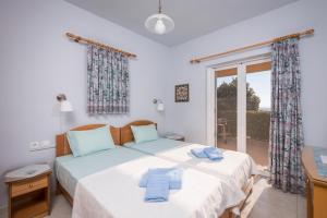 Postel nebo postele na pokoji v ubytování Cretan View