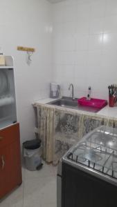 a kitchen with a sink and a counter top at El descanso in Bogotá