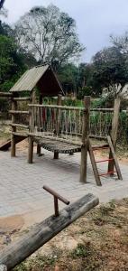a park with a bench and a gazebo at Sitio Terra Azul in Guarulhos