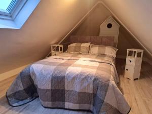 a bedroom with a bed and two night stands at Connemara Ocean Escape in Galway