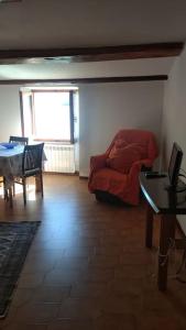 a room with a bed and a table and a dining room at Rosa del Mare in Portovenere