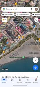 a map of a city on a cell phone at Tamarindo 5 in Benalmádena