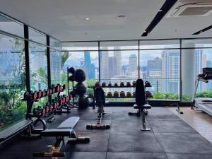 a gym with a view of a city skyline at Comfy & Cozy Suites 3PX @ Colony, Near Monorail & Quill City Mall in Kuala Lumpur