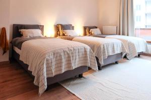 En eller flere senge i et værelse på Tienne d'Anvers