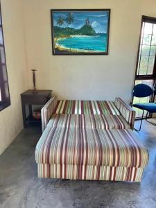 A bed or beds in a room at Chalé Azul