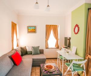 a living room with a couch and a table at The Suite Apart Hotel in Antalya