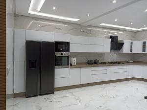 La cuisine est équipée de placards blancs et d'un réfrigérateur noir. dans l'établissement Luxueuse Villa, à Béni Mellal