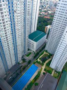 an aerial view of a city with tall buildings at Grass Residences by Team A in Manila