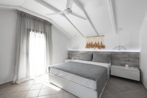 A bed or beds in a room at Elani Cactus House
