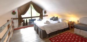 A bed or beds in a room at Aparthotel Claviere