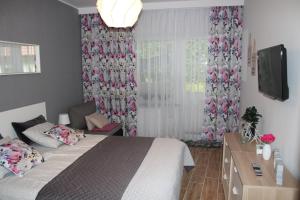 Posteľ alebo postele v izbe v ubytovaní Sunny Adventure Baltic Apartament + 37 fotografií
