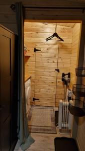 a bathroom with a toilet and a wooden wall at Sydalen house in Kleppstad +49 photos