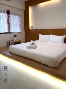 Postel nebo postele na pokoji v ubytování Chunyu B&B