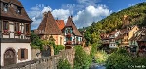 a view of a town with a river and buildings at Gîte, Jacuzzi/Sauna à Colmar in Logelbach