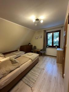 Posteľ alebo postele v izbe v ubytovaní Apartamenty Złota Palma