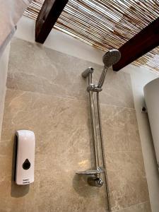 a shower in the corner of a bathroom at Yurt in La Nucia met zwembad in La Nucía