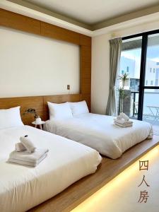 Postel nebo postele na pokoji v ubytování Chunyu B&B