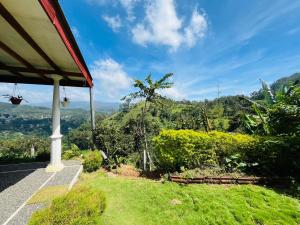 a room with a view of a mountain at Black Bridge View Cottage in Ella