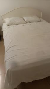 En eller flere senge i et værelse på Departamento Frente al Mar