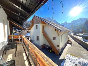 a small house on the roof of a building at Apartments Kosir in Kranjska Gora